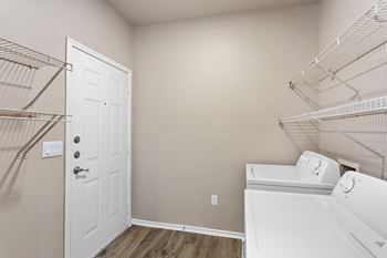 A laundry room with a washer and dryer